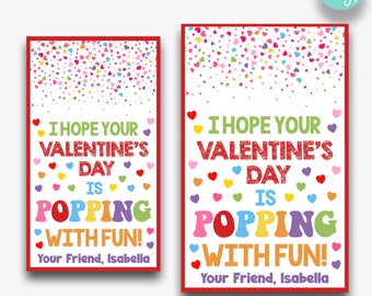 Puede incluir: Dos tarjetas de San Valentín con borde rojo, corazones coloridos y el texto "I Hope Your Valentine's Day Is Popping With Fun!". Incluye dos tamaños: 5,08 cm x 8,89 cm y 6,35 cm x 10,16 cm.
