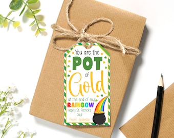 May include: A white gift tag with green shamrocks and a striped border. The tag reads "You are the POT of Gold at the end of my RAINBOW Happy St. Patrick's Day! From. Isabella".