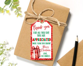 May include: A wrapped present in brown paper, tied with twine. A red and white gift tag is attached, bearing the words "thank you" and "Merry Christmas". The tag also includes the words "FOR ALL YOU DO! YOU ARE APPRECIATED MORE THAN YOU KNOW! LOVE, THE HINKLES."