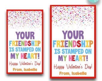 May include: Two Valentine's Day cards with a red border. The cards have the text "YOUR FRIENDSHIP IS STAMPED ON MY HEART!" in colorful letters. The cards also say "Happy Valentine's Day!" and "From, Isabella."