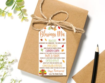 May include: A white gift tag with a Thanksgiving theme. The tag features a turkey illustration and the text "Blessings Mix" with a list of Thanksgiving-themed food items and their symbolic meanings. The text also includes the phrase "Happy Thanksgiving!" and "Love, The Hinkle Family."