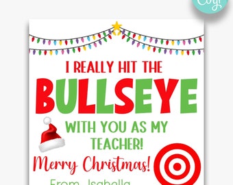 May include: A Christmas-themed printable gift tag with a red and green bullseye target, a Santa hat, and the text "I really hit the bullseye with you as my teacher! Merry Christmas! From, Isabella".