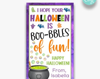 May include: A printable Halloween card with a purple background and a cauldron filled with green liquid. The card says "I hope your Halloween is boo-bbles of fun!" and "Happy Halloween!" with a ghost, bat, and ghost illustrations. The card is signed "From, Isabella".