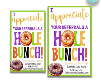 May include: Two printable business card designs featuring a donut with the text "I appreciate your referrals a hole bunch!" and the name "Kathryn Hinkle" with contact information. The cards are available in two sizes: 2 inches by 3.5 inches and 2.5 inches by 4 inches.