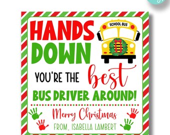 May include: A printable Christmas card for a school bus driver. The card features a yellow school bus with a Christmas wreath on the front, red and green striped borders, and the text "Hands Down You're The Best Bus Driver Around! Merry Christmas From, Isabella Lambert".