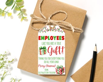 May include: White gift tag with red and green text that reads "Employees like you are a true Gift! Thank you for everything you do all year long! Merry Christmas! From, Southwestern Trucking". The tag is decorated with a red and green gift box and a string of Christmas lights.