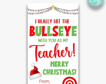May include: A Christmas-themed printable gift tag with a red and green bullseye target and the text "I really hit the bullseye with you as my teacher! Merry Christmas!"  From, Isabella Lambert.