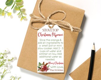 May include: A white gift tag with red and green text that reads "Stovetop Christmas Potpourri". The tag includes instructions for making potpourri and a festive Christmas greeting that says "Merry Christmas With Love, The Hinkles".