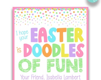May include: A pink printable card with a white background and colorful confetti border. The card says "I hope your Easter is DOODLES OF FUN!" with the text in colorful, playful letters. The card is signed "Your Friend, Isabella Lambert".