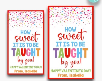 May include: Two printable Valentine's Day cards with a colorful heart confetti background. The text on the cards reads "How sweet it is to be taught by you!" with the words "TAUGHT" in rainbow colors. The cards are available in two sizes: 2 inches by 3.5 inches and 2.5 inches by 4 inches.