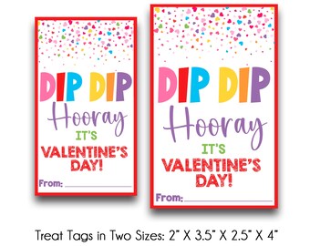 May include: Two Valentine's Day treat tags with red borders. The tags feature the words "DIP DIP Hooray, It's Valentine's Day!" in colourful letters. The top of each tag is decorated with heart-shaped confetti. There is a space to write "From:"
