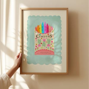 May include: A vintage-style illustration of a box of crayons with a colourful rainbow of crayons sticking out of the top. The box is decorated with flowers and the text "Crayons Art is all natural sunshine".