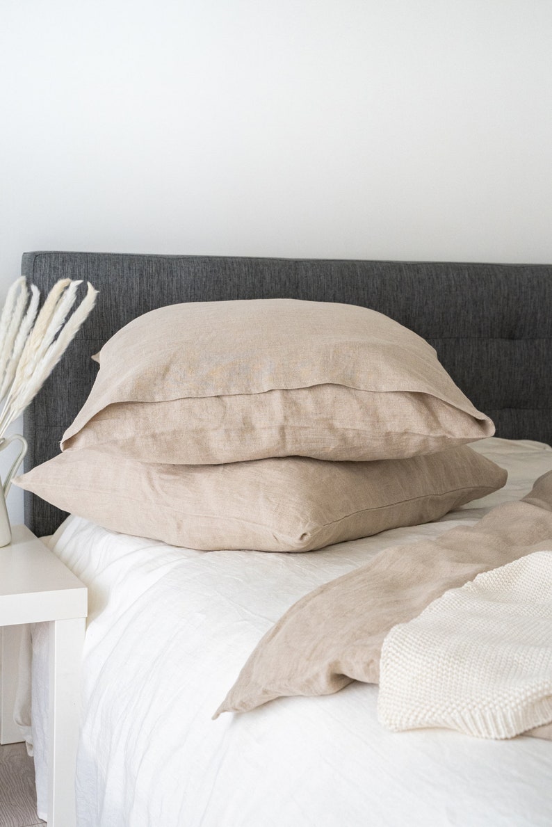 Natural light linen duvet cover and two pillowcases in various colors suitable for farmhouse living, best for minimalist or boho style.