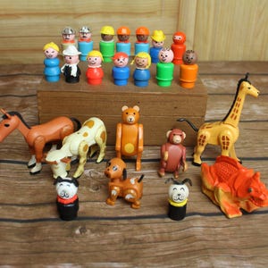 May include: A collection of vintage Fisher-Price Little People figures and animal toys. The set includes various figures with different colored hats and outfits, along with animal figures such as a horse, giraffe, and bear.