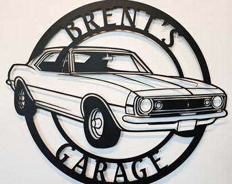 May include: Black metal sign with the text "Brent's Garage" in a circle. A white classic car is inside the circle.
