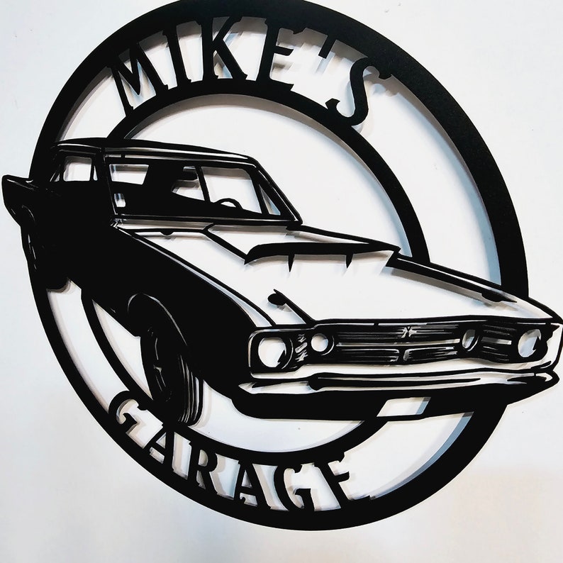 May include: Black metal silhouette of a classic car with the words "Mike's Garage" in a circle around it.