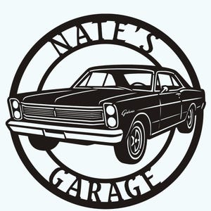 May include: Black and white metal sign depicting a classic car. The sign is circular, with the words "Nate's Garage" in a curved font. The car has the word "Galaxie" on the side, and is a vintage model.
