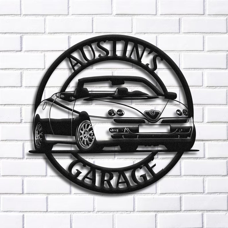 May include: Black metal sign with a white convertible car and the text "Austin's Garage" in a circle.