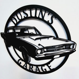 May include: Black metal sign with a silhouette of a classic car and the text "Dustin's Garage".