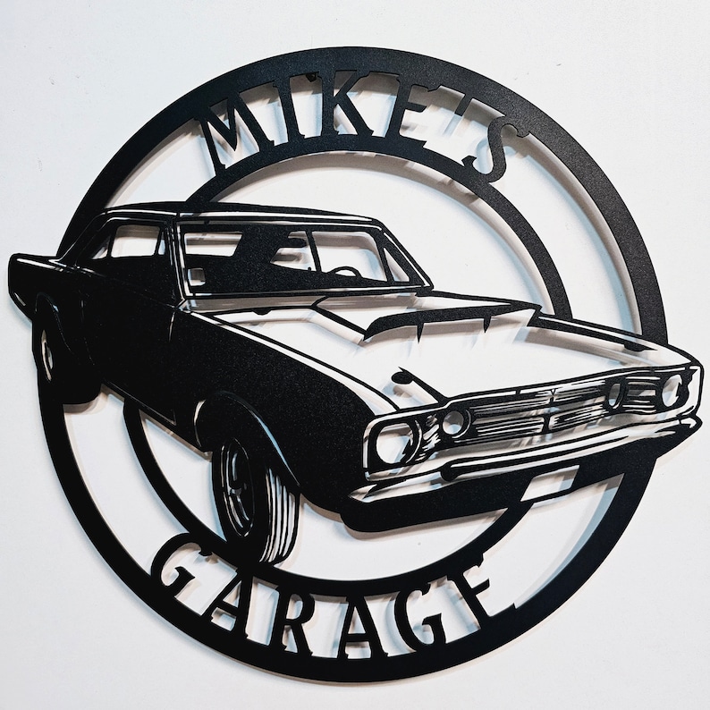 May include: Black metal sign with a silhouette of a classic car and the text "Mike's Garage" in a circular design.