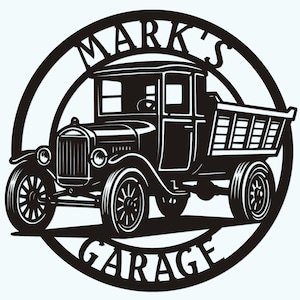 May include: Black and white metal sign depicting a classic truck design. The truck is set within a circular frame, with the words "MARK'S GARAGE" in a bold font. The truck design includes detailed features.