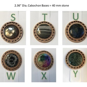 May include: Six round wooden bases with a decorative border, each featuring a different 2.36 inch diameter cabochon stone. The stones come in a variety of colours and patterns, including black, white, green, and rainbow.