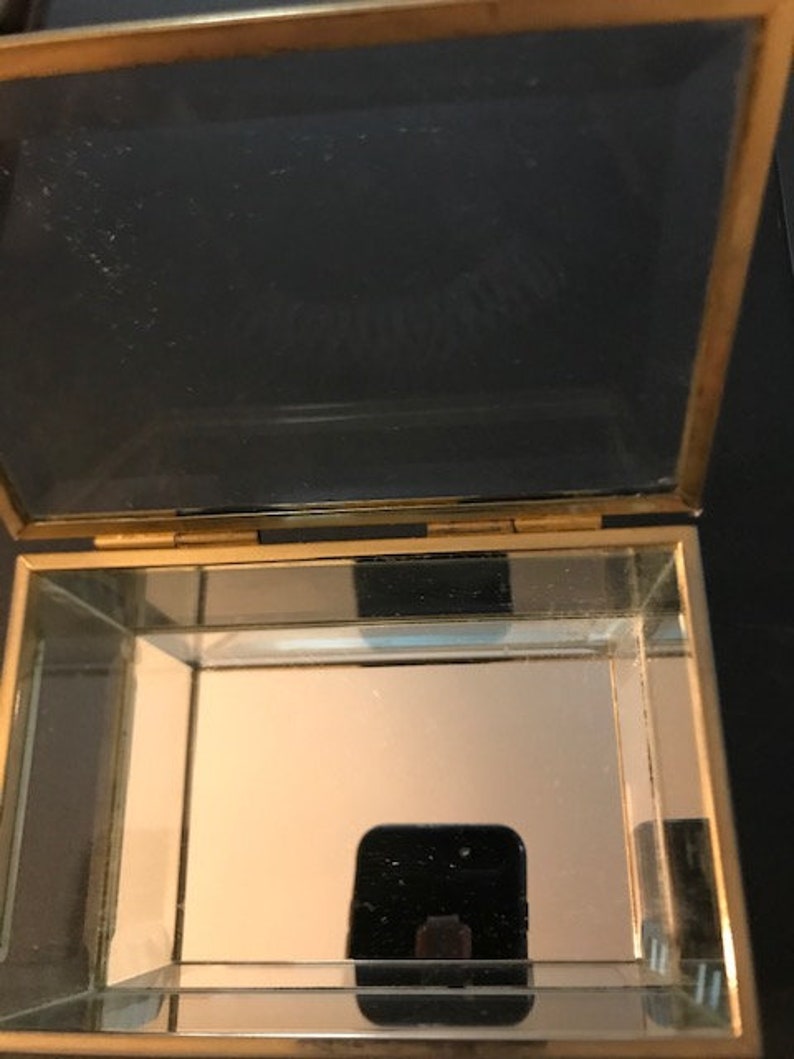 Vintage beveled glass rectangular box with mirrored bottom Measures 4 12L X 3W X 2 12H with feet Great for jewelry or collectibles.