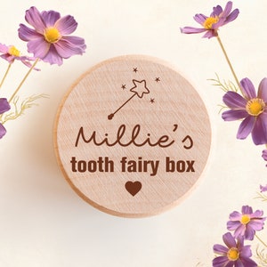 May include: A wooden tooth fairy box with the inscription "Millie's tooth fairy box" and a small heart and a star with a wand on top.