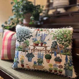Needlepoint pillow finishing service.  Experienced hand sewing. Includes backing, twisted cording, and insert. Custom work welcomed.