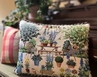 Needlepoint pillow finishing service.  Experienced hand sewing. Includes backing, twisted cording, and insert. Custom work welcomed.