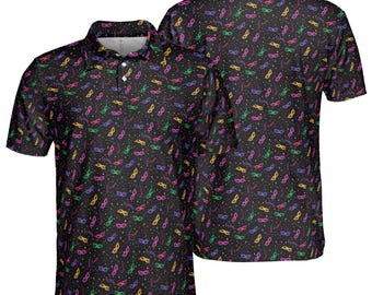 May include: Black polo shirt with a pattern of colorful masquerade masks and confetti. The shirt has a collared neckline and a button-down placket. The short-sleeved shirt is shown from the front and back.