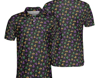 May include: Black polo shirt with a repeating pattern of Mardi Gras masks in purple, green, and gold. The shirt has a collared neckline and short sleeves. The image shows the front and back of the shirt.