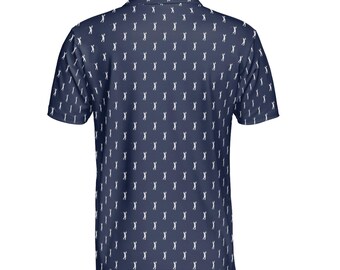 May include: Navy blue polo shirt with a white golfer pattern. The short-sleeved shirt has a collared neckline and a buttoned placket. The golf-themed shirt is suitable for casual wear or sports activities.