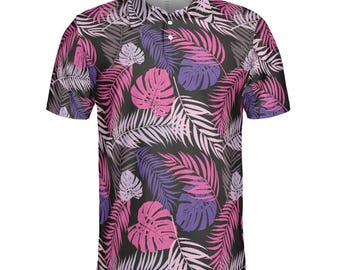 May include: A short-sleeved polo shirt with a black background and a vibrant tropical leaf pattern in shades of pink, purple, and white. The shirt has a classic collar and button-up front.
