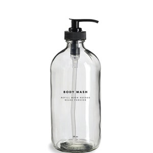May include: A clear glass bottle with a black pump dispenser. The bottle is labeled "BODY WASH" and "REFILL WHEN NEEDED REUSE FOREVER". The bottle is 16 oz.