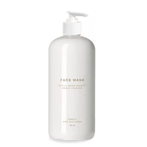 May include: White plastic pump bottle with a white label that reads "FACE WASH REFILL WHEN NEEDED REUSE FOREVER SIMPLY FOR THE HOME 16 oz".