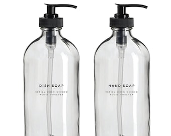 May include: Two clear glass bottles with black pump tops and labels that read "DISH SOAP REFILL WHEN NEEDED REUSE FOREVER" and "HAND SOAP REFILL WHEN NEEDED REUSE FOREVER". Each bottle contains 16 ounces of liquid.