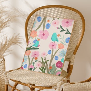 Pretty art print featuring three abstract blue birds perching on wildflowers and foliage, on a cream background.