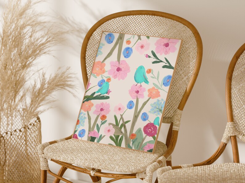 Pretty art print featuring three abstract blue birds perching on wildflowers and foliage, on a cream background.