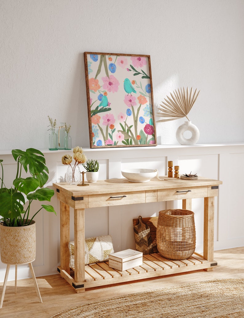 Pretty art print featuring three abstract blue birds perching on wildflowers and foliage, on a cream background.
