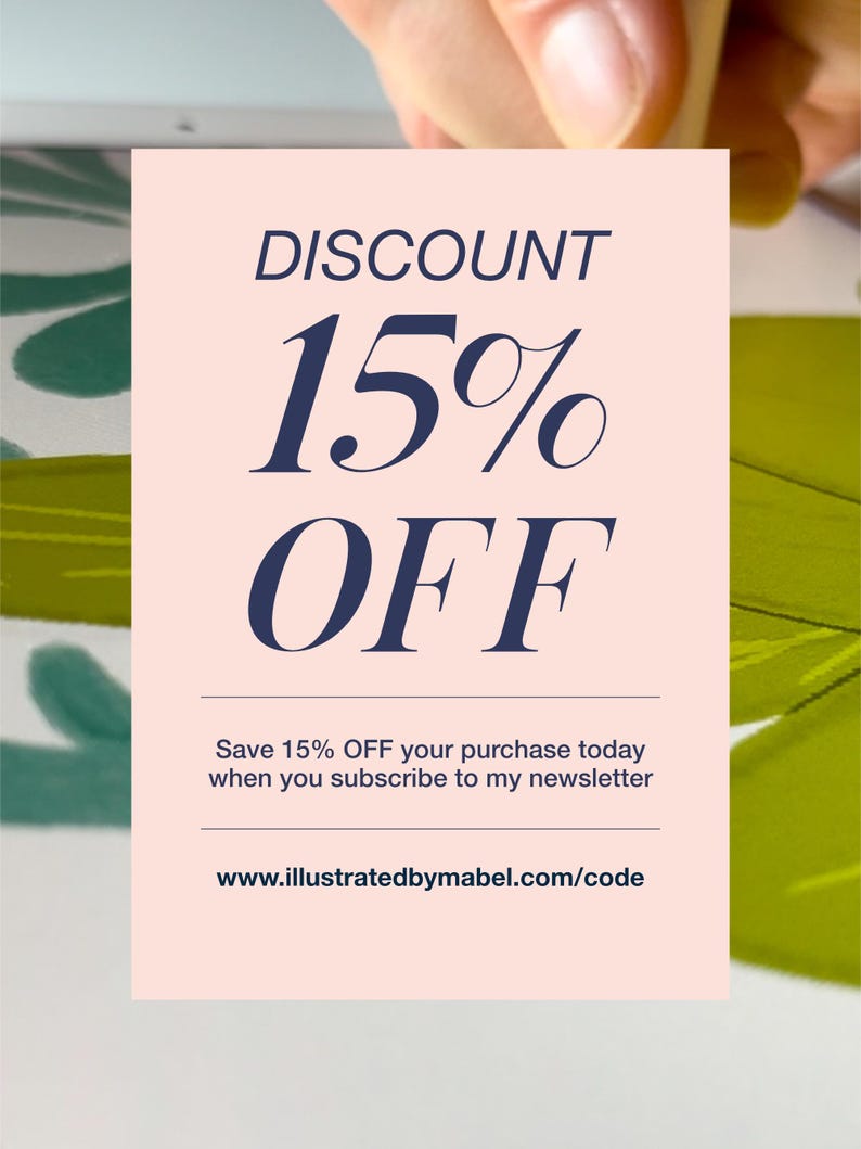 May include: A pink and white discount card with the text "DISCOUNT 15% OFF" in blue text. The card also includes the text "Save 15% OFF your purchase today when you subscribe to my newsletter" and the website address "www.illustratedbymabel.com/code".