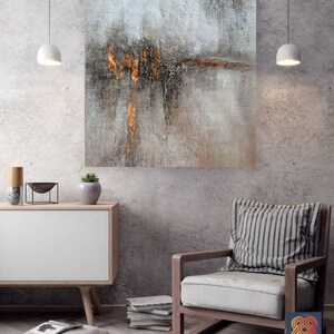 May include: Abstract painting with shades of gray, brown, and gold. The painting has a textured surface and a modern style.