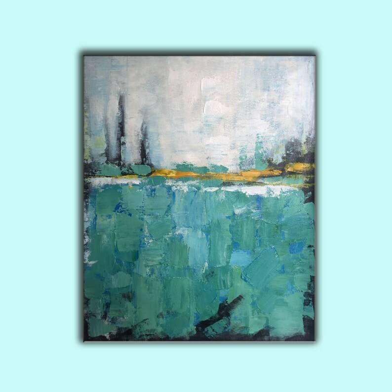 May include: Abstract painting with a green and blue color scheme. The painting features a horizontal line of yellow and gold paint across the middle, with a white background above and a green and blue background below.