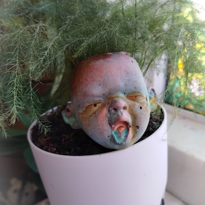 Creepy baby face plant mask/costume
