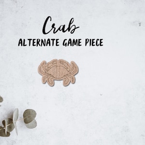 May include: A wooden crab game piece, a simple outline of a crab with no color. The text "Crab Alternate Game Piece" is above the crab.