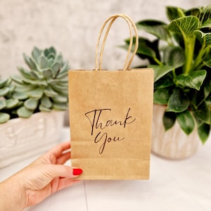 Merci sac de cadeaux. Sac kraft moyen en papier brun écologique. Anniversaire, Hôtel, EVJF, Shower de bébé, Invités à un mariage, Entreprise