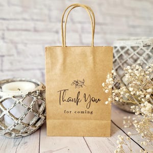 Merci d'avoir choisi le sac de cadeaux. Petit sac en papier brun écologique kraft. Anniversaire, hôtel, enterrement de vie de jeune fille, sacs de bienvenue pour les invités du mariage