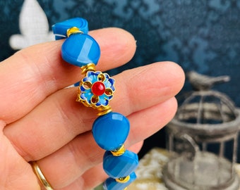 Handmade jewelry for women beaded ethnic blue and gold bracelet with enamel bead.