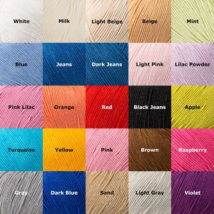 May include: A color palette of yarn skeins, each labeled with a color name. Colors include white, milk, light beige, beige, mint, blue, jeans, dark jeans, light pink, lilac powder, pink lilac, orange, red, black jeans, apple, turquoise, yellow, pink, brown, raspberry, gray, dark blue, sand, light gray, and violet.