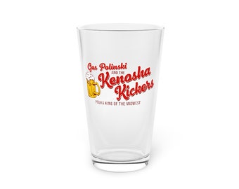 May include: A clear glass pint glass with a red and yellow graphic of a beer stein and the text "Gus Polinski and the Kenosha Kickers Polka King of the Midwest".